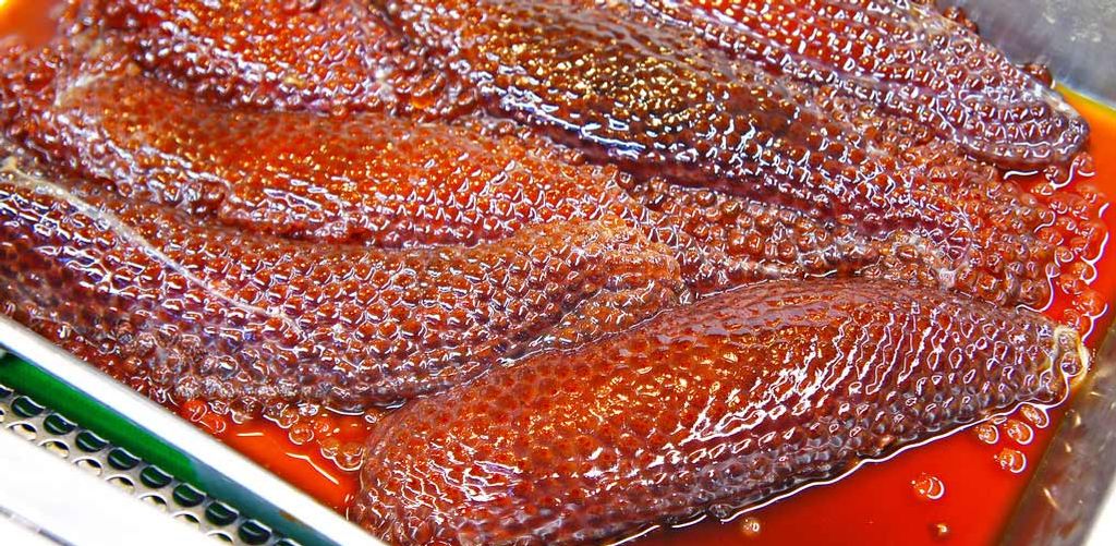 Sujiko, salmon roe still in the ovarian sacs, immersed in a marinade of soy sauce and mirin, ready to be processed into Ikura.