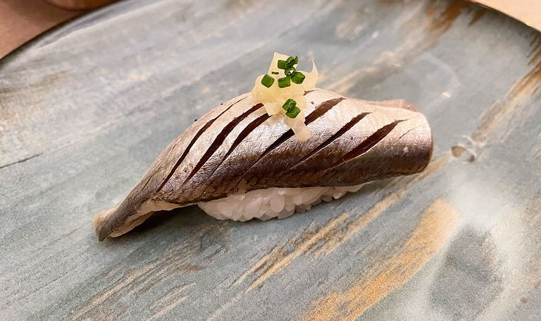 Hand formed sushi (nigiri-zushi) for which a European sardine (Japanese nishi-iwashi) served as an ingredient.