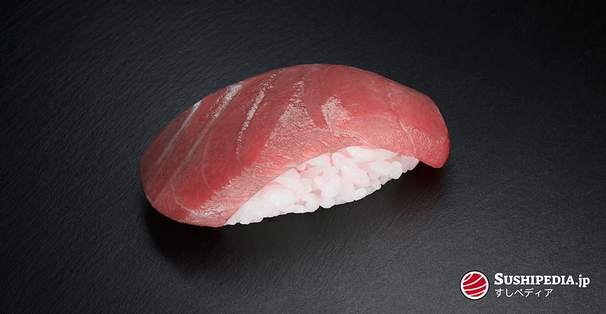 Photo of a freshly prepared sushi (nigiri sushi) with the ingredient that is called Maguro in Japanese.