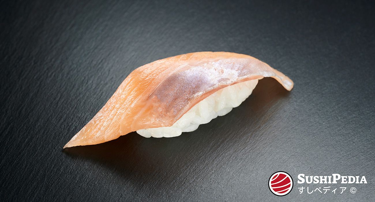 Photo of a freshly prepared sushi (nigiri sushi) with the ingredient that is called Iwana in Japanese.