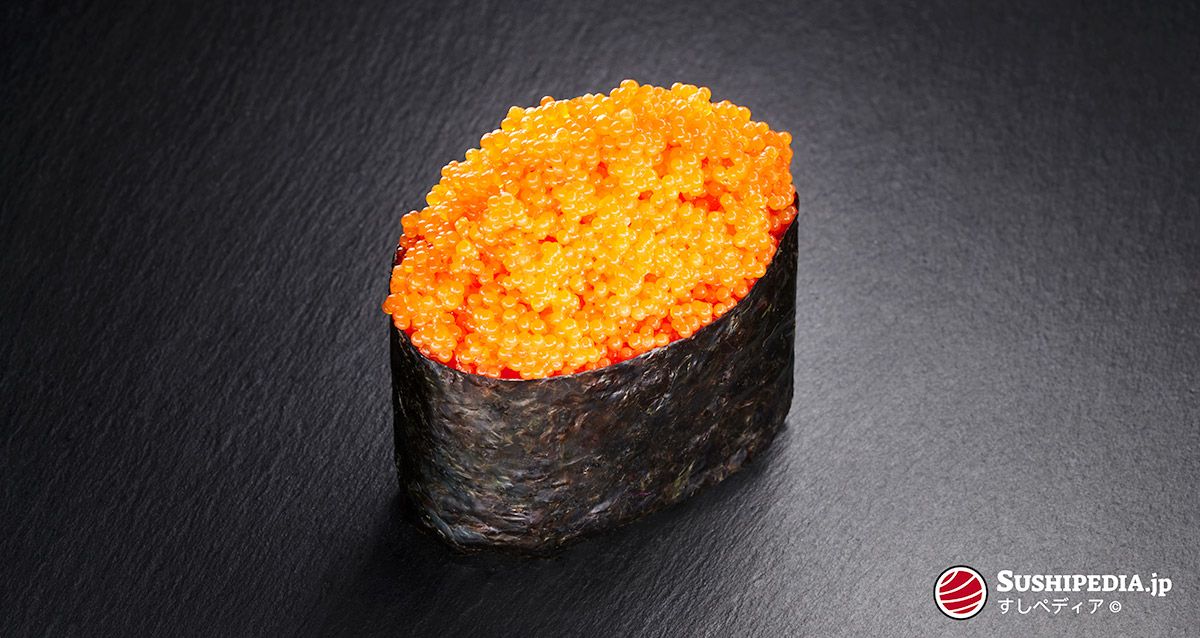Photo of a freshly prepared sushi (gunkan maki sushi) with the ingredient that is called Tobiko in Japanese.