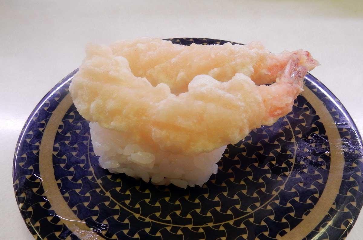 Two ebi nigiri sushis on a plate. 
				Mikkabie. 
				日本語: エビ天の握り. 
				Wikimedia Commons. 
				Attribution-ShareAlike 4.0 International (CC BY-SA 4.0). 
				
