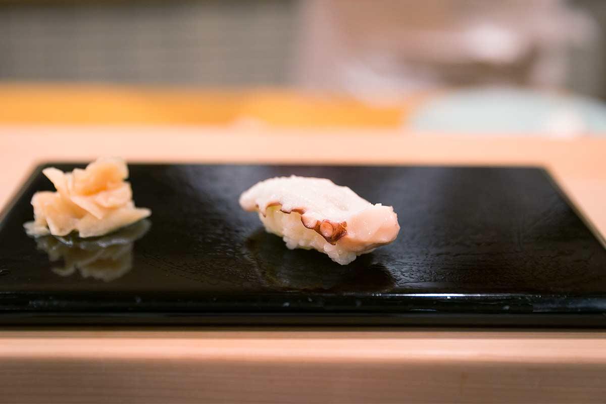Octopus sushi on a plate. 
				City Foodsters. 
				Tako (octopus) - Sukiyabashi Jiro, Tokyo, JP. 
				flickr.com. 
				Attribution 2.0 Generic (CC BY 2.0). 
				